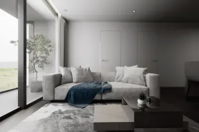 Современная гостиная с серым диваном и синим пледом