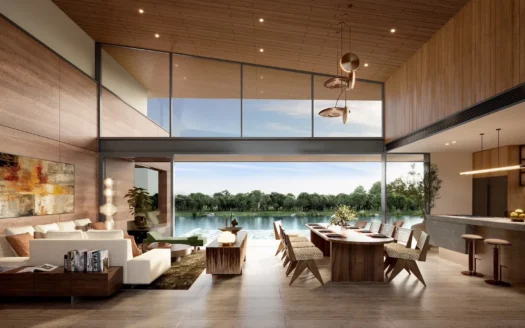 Освещенная солнцем открытая гостиная и обеденная зона с видом на озеро