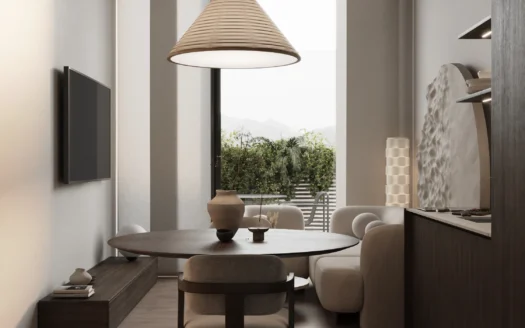 Внутренняя обеденная зона с круглым деревянным столом и ротанговой лампой