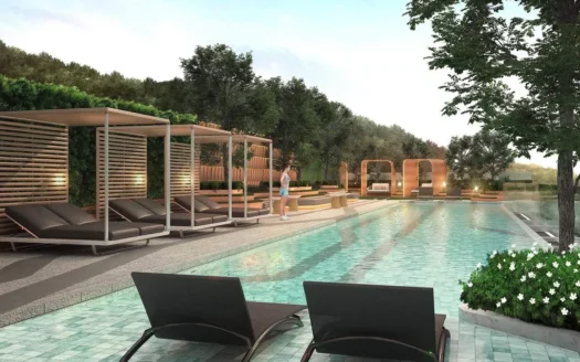 Пляжные шезлонги под деревянными навесами у бассейна с зеленью