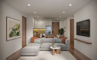 Гостиная с угловым серым диваном и телевизором на стене