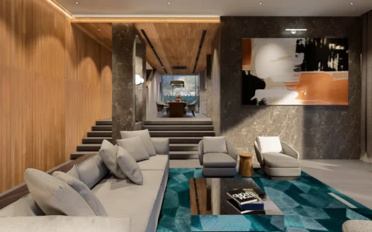 Гостиная с серыми диванами, мраморными стенами и бирюзовым ковром