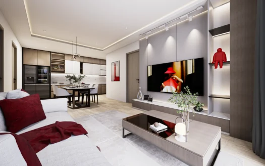 Открытая гостиная с серым диваном, красными подушками и телевизором на стене