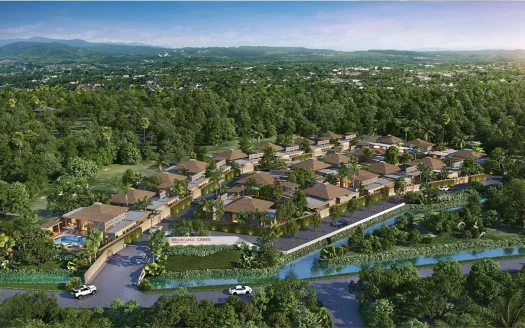 Аэрофотосъемка вилл с коричневыми крышами среди деревьев