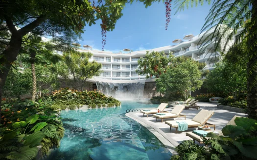 Бассейн с каскадом водопада, окружён шезлонгами и тропическими растениями
