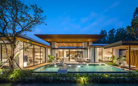 Экстерьер современной виллы с подсвеченным бассейном на закате