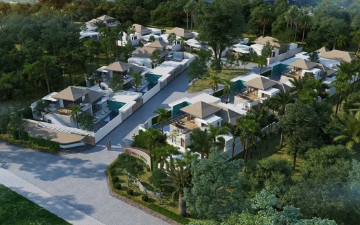 Воздушный снимок белого комплекса вилл с соломенными крышами и деревьями