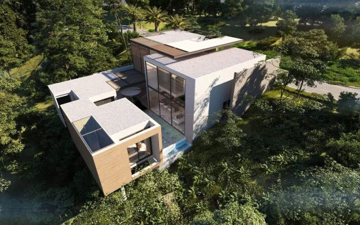 Воздушный вид на современный белый дом в лесу со стеклянной фасадой